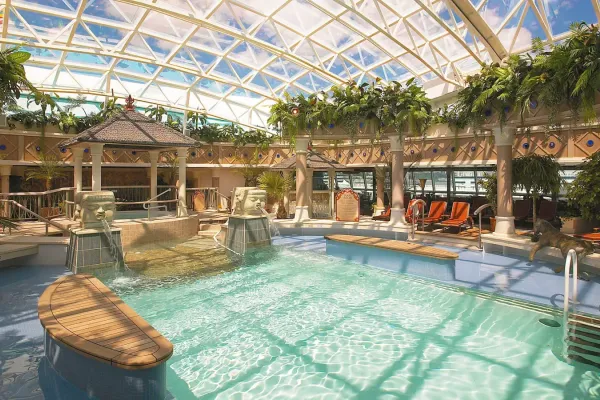 The pool onboard Serenade of the Seas features a retractable glass roof,